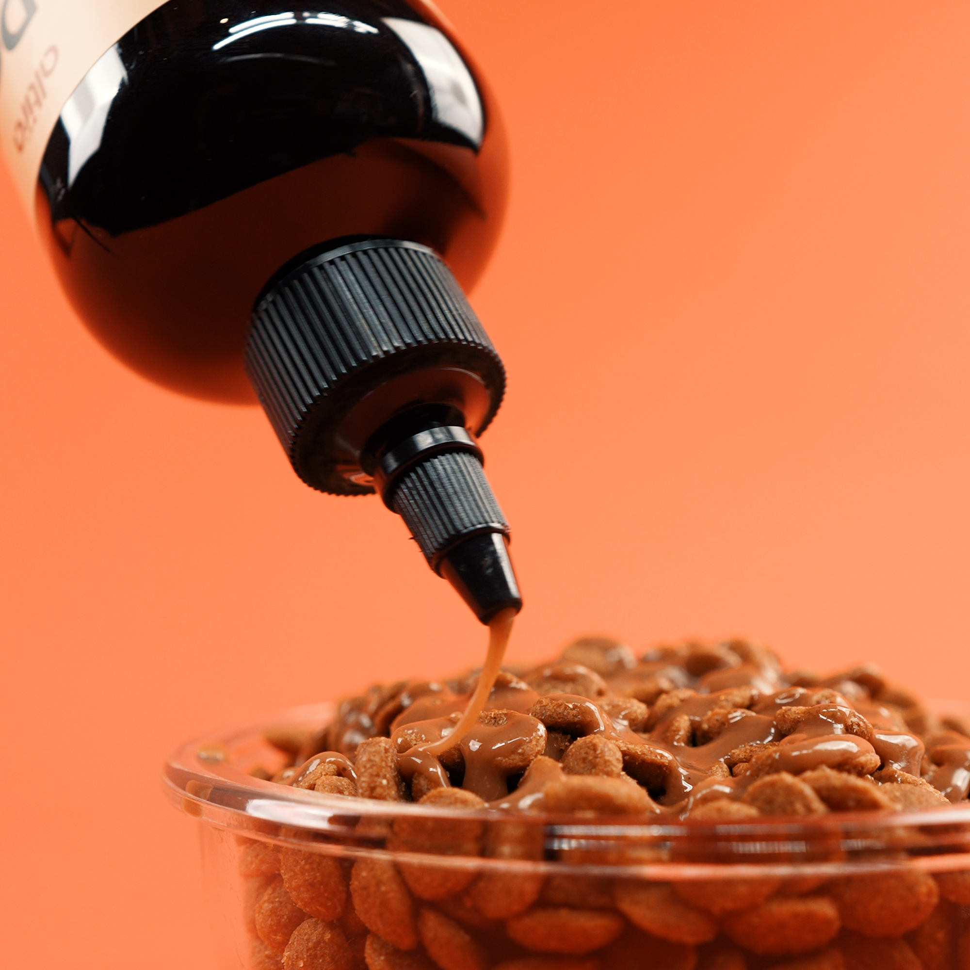 Altira Dog Gravy being poured over kibble
